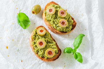 Tasty bruschetta with green olives for a breakfast