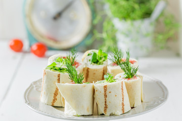 Tasty rolls with vegetables, cheese and herbs for a brunch