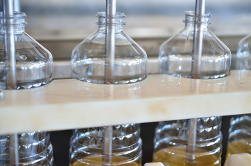 Sunflower oil. Factory line of production and filling of refined oil from sunflower seeds. Factory conveyor of food industry