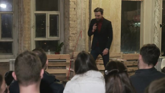 The speaker telling a jokes on a stand-up show