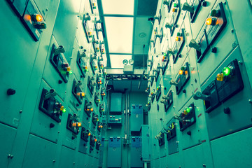 Vintage and blur tone of Electrical switchgear room,Industrial electrical switch panel on plant  and process control with grainy style.