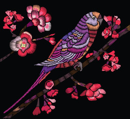 Obraz premium Flowering branch with a bird on a black background. Vector Illustration for embroidery, patches and stickers.