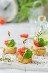 Closeup of crostini made with mozzarella and tomato