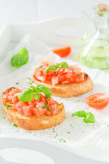Tasty bruschetta with tomato and basil for a snack
