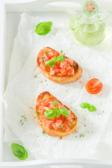 Crisp bruschetta with basil and tomato for a snack