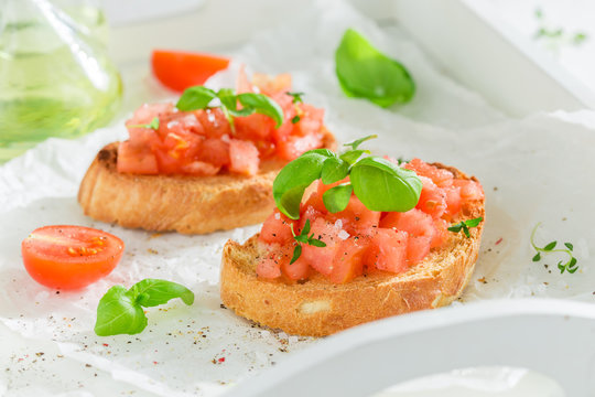 Fresh bruschetta with basil and tomato for a snack