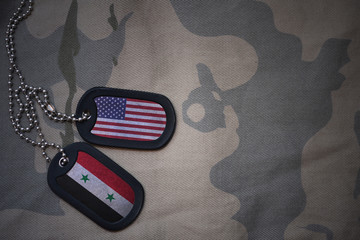 army blank, dog tag with flag of united states of america and syria on the khaki texture...