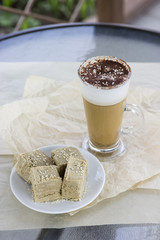 Latte halva. Unusual oriental hot coffee cocktail in a cafe