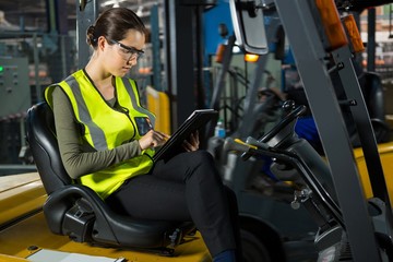 female worker using digital tablet