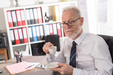 Businessman having coffee break