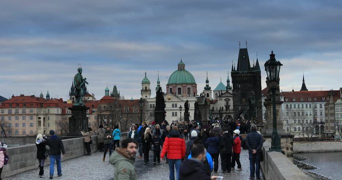 Tourist Visiting Charles Bridge Old Town Prague at Czech Republic in winter time