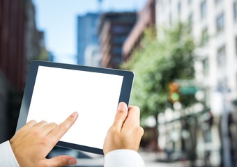 Hands with tablet in the city
