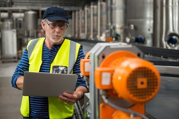 Manual worker analyzing machinery 