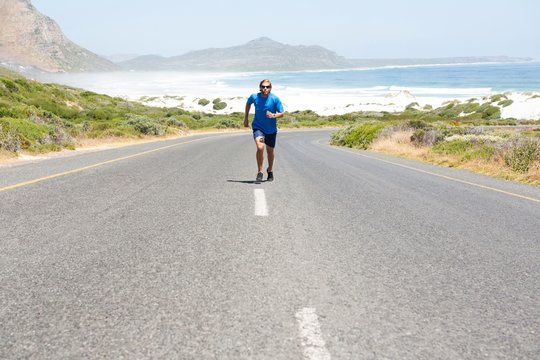 Athlete running on road