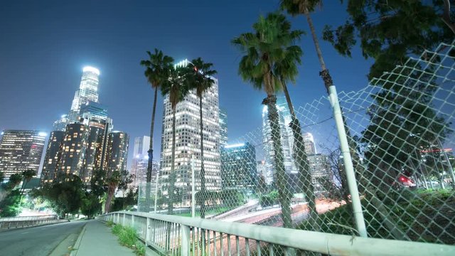 Los Angeles Downtown Skyscrapers Freeway Traffic Time Lapse with Pam Trees 