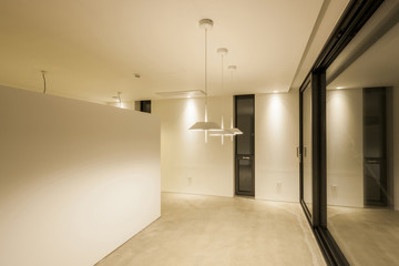 white empty office, showroom with pendant lighting, window.