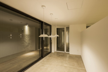 white empty office, showroom with pendant lighting, window.