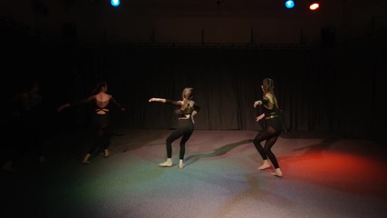  Young students in dance rehearsal for school theatre production