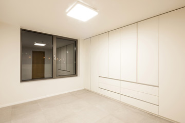 white empty room with wardrobe close for cleaning.