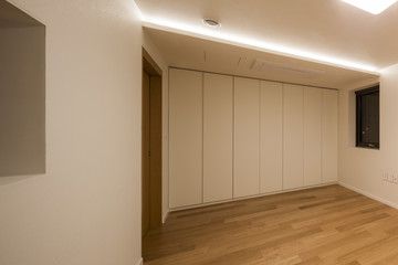 white empty room with wardrobe close for cleaning.