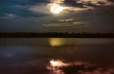 Fototapeta premium Full moon with reflection in sea. Beautiful nature background.