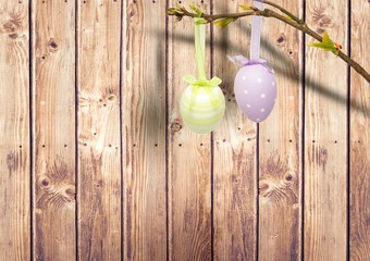 Easter eggs hanging in the garden. - Powered by Adobe