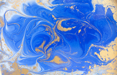 Fototapeta na wymiar Blue and golden liquid texture. Watercolor hand drawn marbling illustration. Ink marble background.