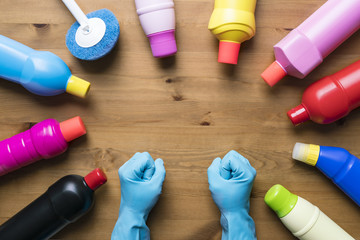 Women prepare to clean house on wood table