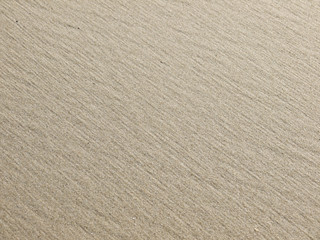 Sandy beach background. Detailed sand texture