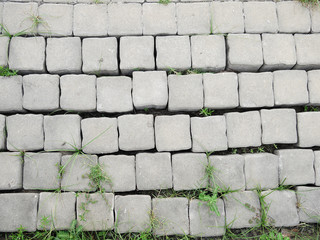 Surface of a broken cement brick pavement for textural background