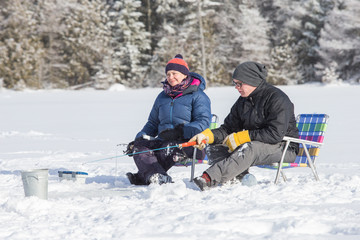 Couple ice fishing