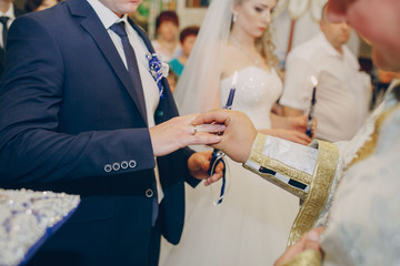 beautiful young couple takes a wedding in the Church