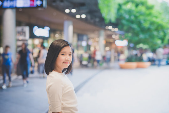 Asian girl walking in the city,