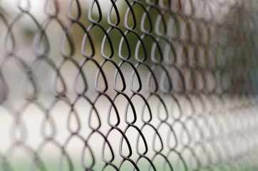 chain link fence with blurred background and foreground