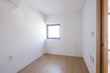 white empty room with window, wood floor