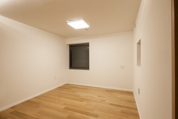 white empty room with window, wood floor