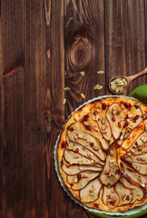 Top view of Pear tart with cheese on wooden table with copy space