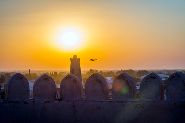 Obraz premium Silhouette of old city wall in sunset, Khiva