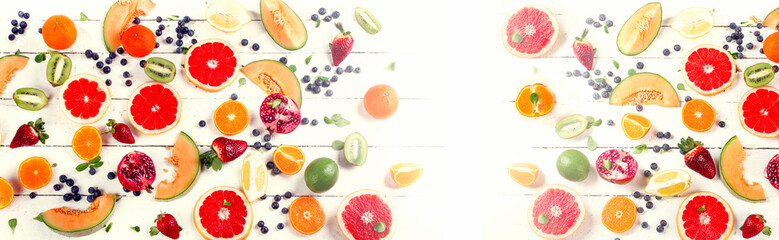 Mixed fruits on a white wooden table.