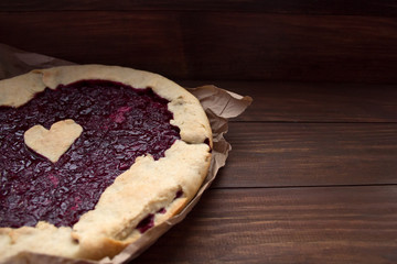 homemade cherry pie on a wooden background