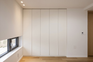 white empty room with window, wardrobe, door at the day.