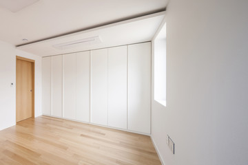 white empty room with window, wardrobe, door at the day.