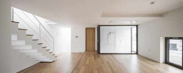 white empty living room with stair, window, pendant lighting, stair at the day.