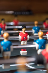 Table football kicker with miniature players