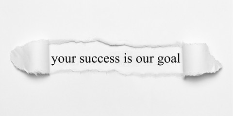 your success is our goal on white torn paper