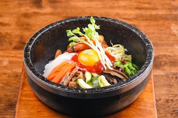 Bowl of bibimbap on the wooden table, Traditional korean food