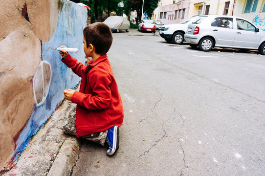 Child painting a wall