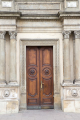 The vintage brown  wooden front door of an old house