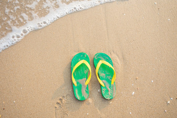 sandal on the sand beach.