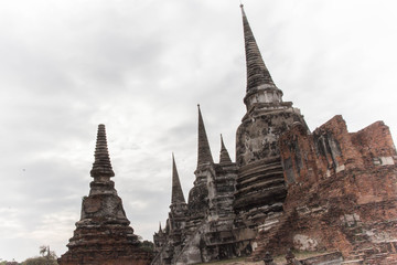Fototapeta premium Ancient break pillar pagoda and sky at wat phra sri sanphet temple Ayutthaya Thailand